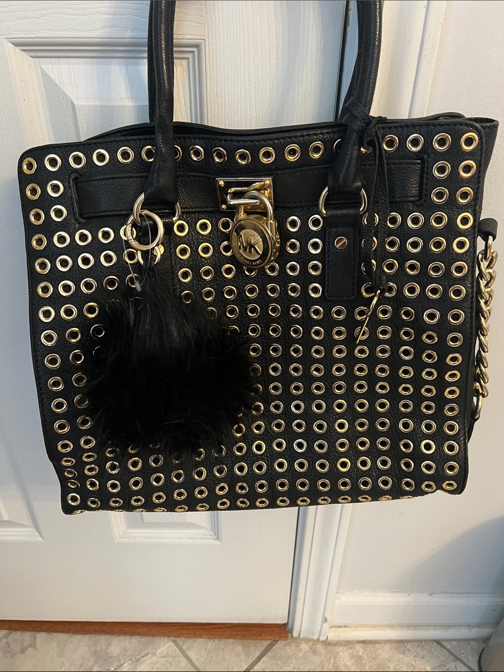 Michael Kors Black Tote with Gold Eyelet Accents